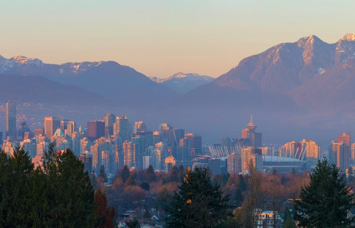 Vancouver British Columbia Canada city skyline and mountain view during sunset panorama